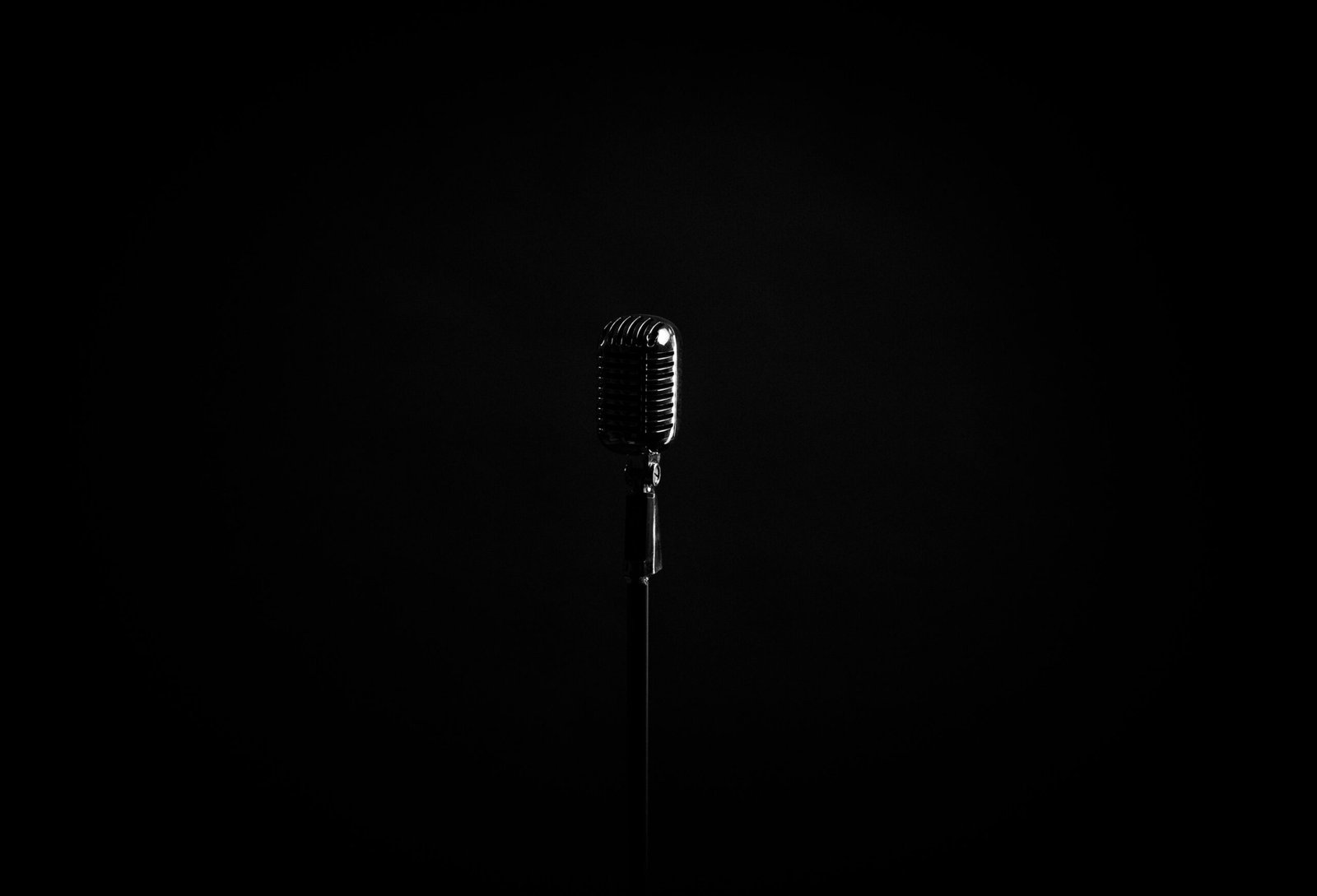 black microphone on black background